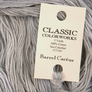 May include: A skein of gray embroidery floss with a label that reads "Classic Colorworks, 5 Yards, 100% Cotton, Not Colorfast, CCT-031, Barrel Cactus".