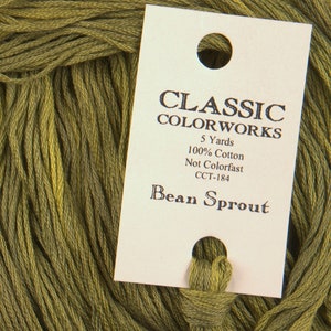 May include: A skein of green embroidery floss labeled "CLASSIC COLOR WORKS" with the details "5 Yards, 100% Cotton, Not Colorfast, CCT-184" and the name "Bean Sprout".
