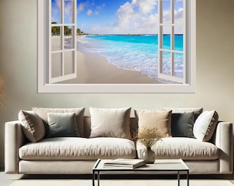May include: A white framed window sticker with an image of a tropical beach scene. The window is open and the view shows a sandy beach with turquoise water and palm trees in the distance.