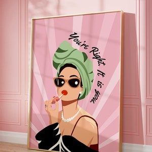 May include: A pink and white illustration of a woman wearing sunglasses, a green turban, and a black dress. She is applying lipstick and the text "You're Right. It is you." is written in black on the pink background.