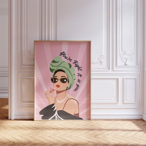 May include: A pink and white poster with a woman wearing a green turban and sunglasses. The text on the poster reads "You're Right. It is you."