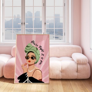 May include: A pink and green illustration of a woman wearing a green headscarf and sunglasses, applying lipstick. The text "You're Right, It is You" is written in white on a pink background.