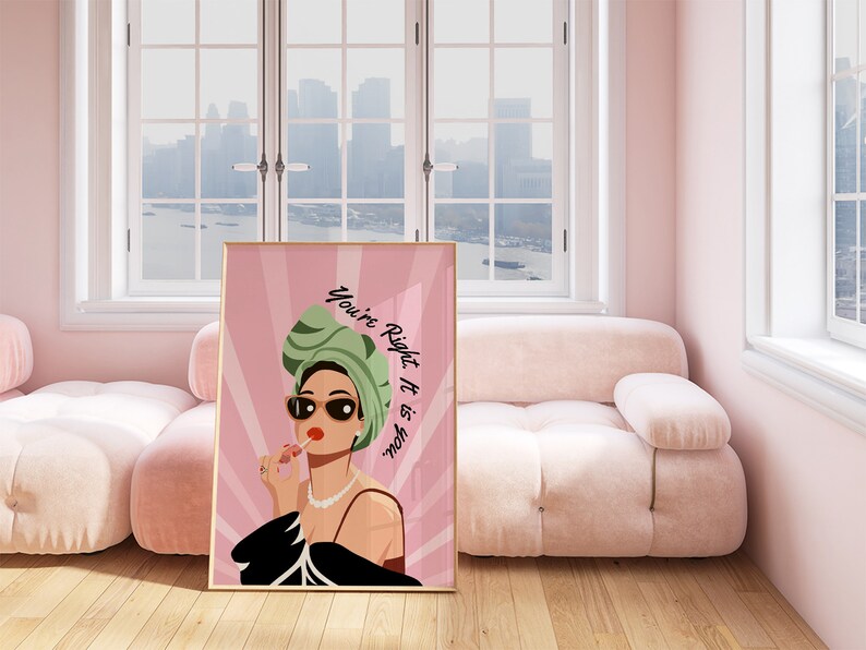May include: A pink and green illustration of a woman wearing a green headscarf and sunglasses, applying lipstick. The text "You're Right, It is You" is written in white on a pink background.