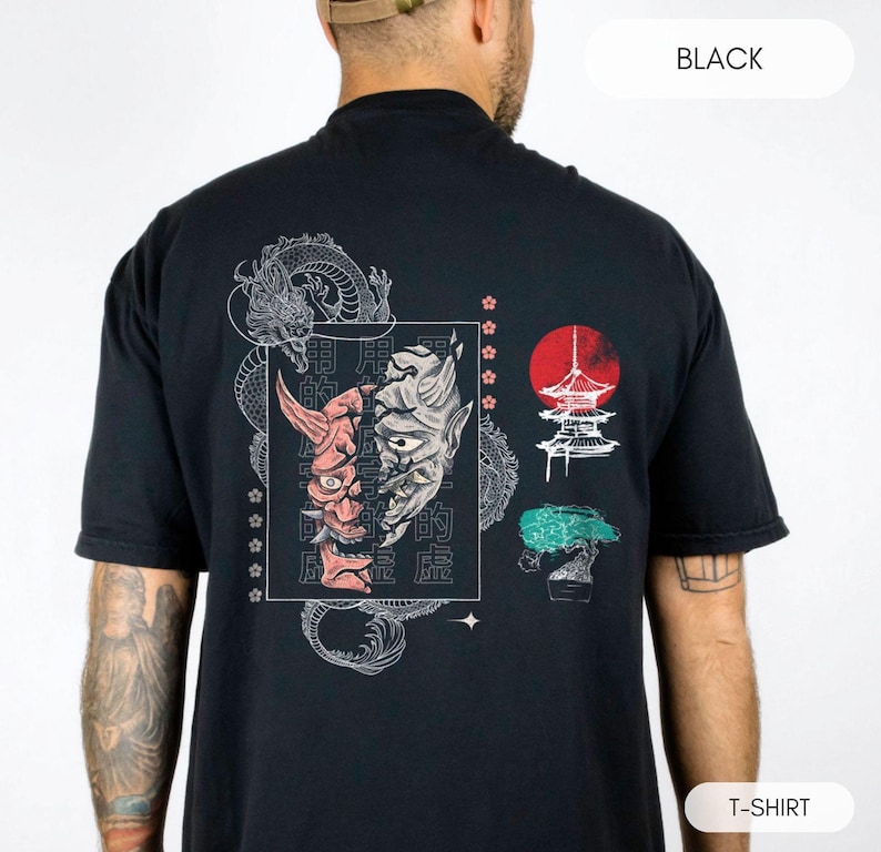 May include: Black t-shirt with a graphic print of a Japanese demon mask, a pagoda, and a bonsai tree. The text on the shirt reads "用尽的魔" in Japanese.