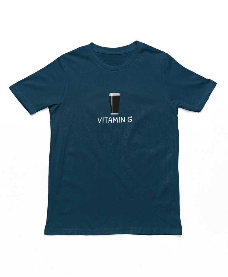May include: A dark blue t-shirt with a white graphic of a pint of beer and the text "Vitamin G".