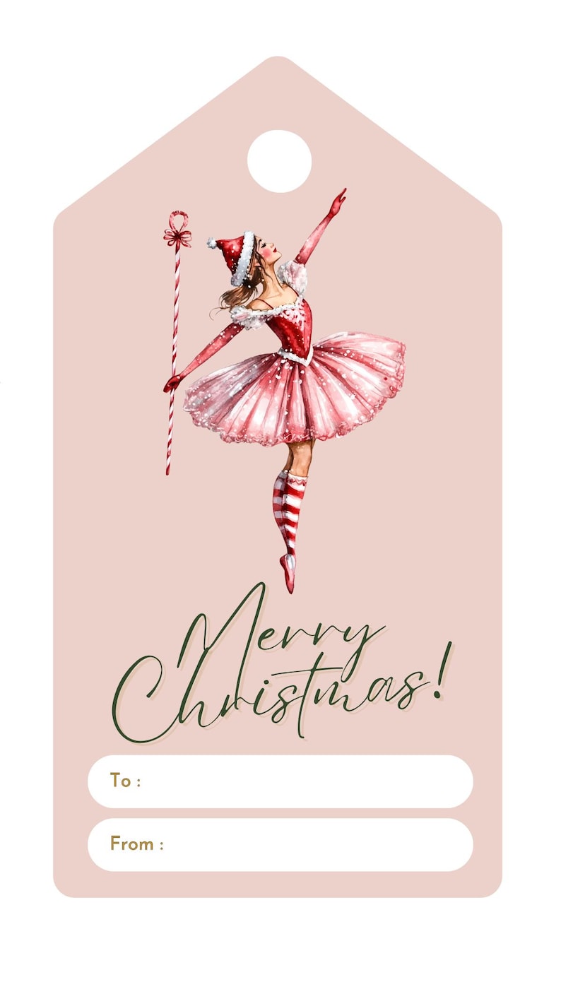 May include: A pink Christmas gift tag with a ballerina wearing a red and white dress and a candy cane. The text "Merry Christmas!" is written in green cursive. The tag has blank spaces for "To:" and "From:".