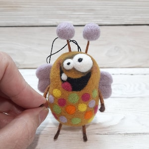 Needle felted cute monster. Wool funny monster. Funny fantasy creature. Needle felted animals. Needle felted fantasy. Felt fairy monster.