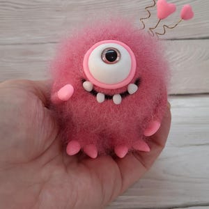 Needle felted cute monster. Wool One-Eyed Monster. Funny fantasy creature. Needle felted animals. Needle felted fantasy. Felt fairy monster.