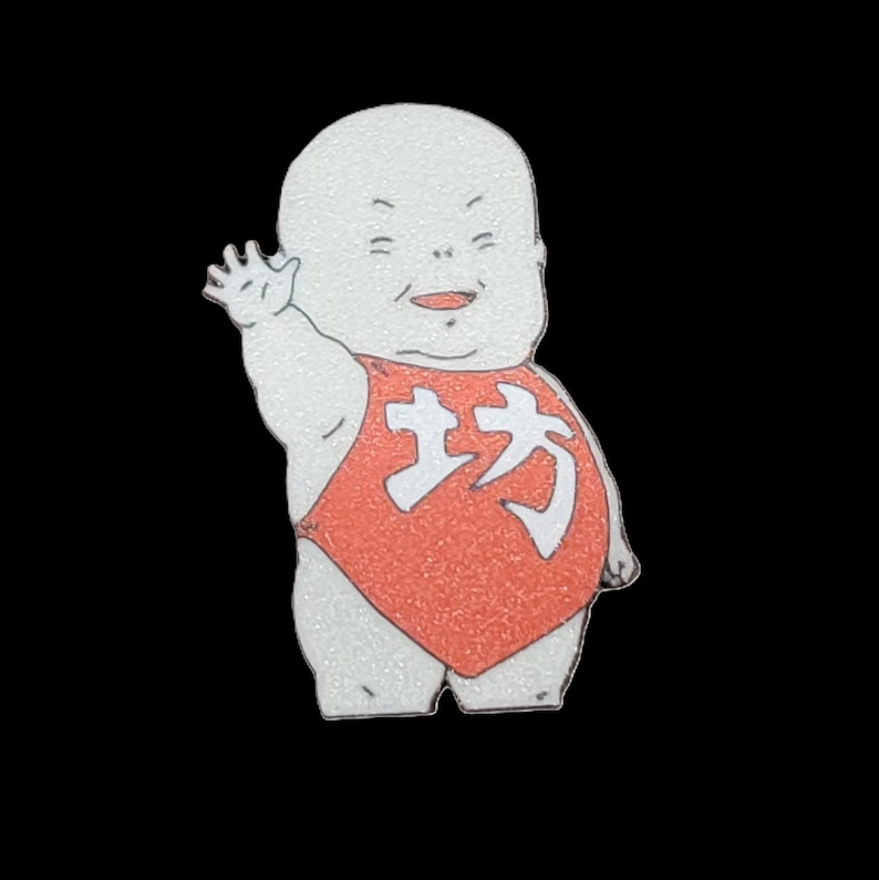 May include: A white cartoon baby with a red and white outfit, waving with a big smile. The outfit has the Chinese character for "direction" on the front.
