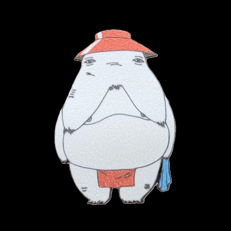 May include: A white, round, cartoon character with a red hat and a red loincloth. The character has a blue towel draped over its arm.