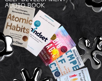 May include: A collection of self-help books, including "Atomic Habits" and "Mindset," arranged on a dark textured surface. The books are white with colorful text and titles. The image includes the text "SELF DEVELOPMENT AUDIO BOOK."