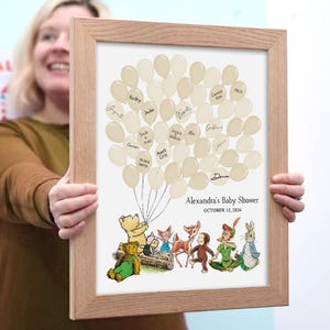 Puede incluir: Un libro de visitas para un baby shower con temática de Winnie the Pooh con fondo blanco y globos beige. Los globos tienen nombres escritos en ellos. El texto "Alexandra's Baby Shower" y "October 12, 2024" está impreso debajo de los globos.