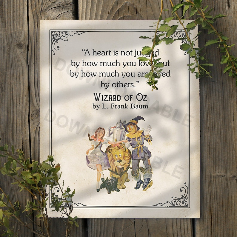 May include: A vintage-style print featuring a quote from "The Wizard of Oz" by L. Frank Baum. The quote reads, "A heart is not judged by how much you love, but by how much you are loved by others." The print features an illustration of Dorothy, the Tin Man, the Scarecrow, and the Cowardly Lion from the book.