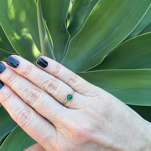 Emerald solitaire ring