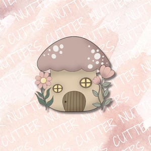 May include: A pink and brown mushroom house with white dots on the roof. The house has two windows and a door. There are pink flowers with green leaves on either side of the house.