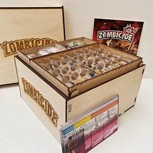 Caisse de rangement et organisateurs Zombicide Superbox pour le jeu et les extensions.