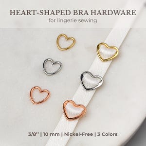 May include: Five heart-shaped bra hardware pieces in gold, silver, and rose gold. The hardware is 3/8 inch or 10 mm in size and nickel-free.  3/8" | 10 mm | Nickel-Free | 3 Colors