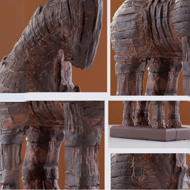 Marble dust Trojan Horse statue with a striated acrylic finish in charcoal and umber shades, on a terracotta backdrop for contrast