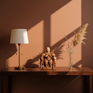 The Neolithic Mother Goddess statue placed near books and candles in a sunlit boho interior. The warm terracotta tones and spiritual presence of the piece bring ancient Anatolian serenity into modern living spaces. A timeless expression of the divine feminine by ArkeoArt.
