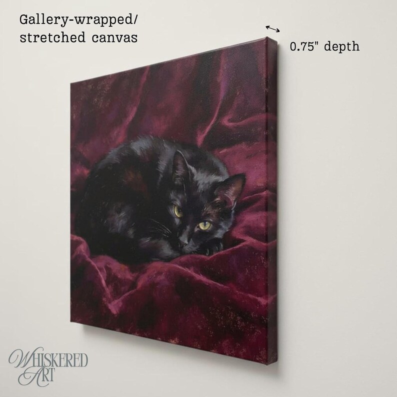 May include: A gallery-wrapped stretched canvas print featuring a painting of a black cat resting on deep burgundy fabric. The artwork has a 0.75 inch depth, showing the side profile of the canvas frame against a plain light background.