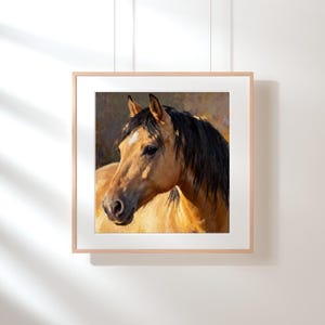 May include: A square framed wall art print featuring an oil painting of a buckskin horse with a black mane and a small white star on its forehead. The horse is shown from the chest up, facing slightly to the left against a dark background.