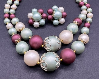 Vintage 1950s 2-strand choker/necklace, matching clip-on earrings set. Pale blue, burgundy, off-white, gold-tone, silver-tone. Japan marked.