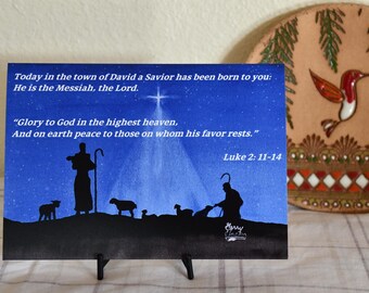 Questa cartolina di Natale annuncia la nascita di Cristo ai pastori che pascolano i loro greggi di notte.