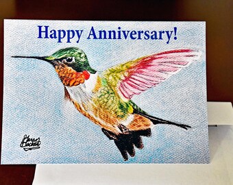 Biglietto di auguri con un colorato colibrì in volo!
