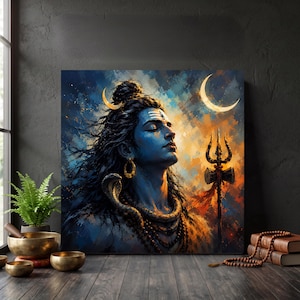 May include: A square wall art print depicting a blue-skinned deity with long dark hair, a crescent moon, and a snake around the neck. The figure has a third eye mark on the forehead and holds a trident. The background features a vibrant, abstract blend of blue, orange, and yellow colors.