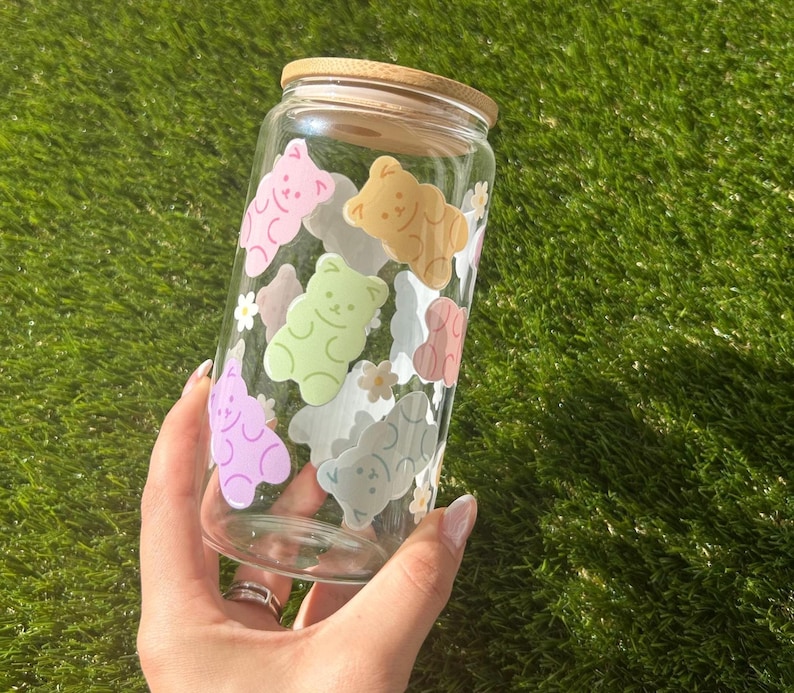 Clear glass cup featuring a fun and vibrant wrap of colorful gummy bears. Perfect for iced drinks like coffee, tea, or boba. Bright, playful design with a kawaii aesthetic.