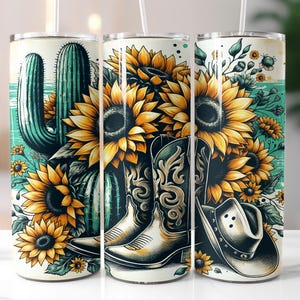 May include: Three white insulated tumblers with a Western-themed design. The design features a cactus, sunflowers, cowboy boots, and a cowboy hat. The color palette includes shades of green, yellow, and brown.