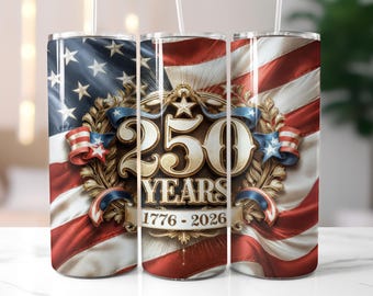 May include: A stainless steel travel mug with a patriotic design. The mug features the American flag, stars, and stripes, with the text "250 YEARS 1776-2026" in a gold emblem. The mug has a white straw.
