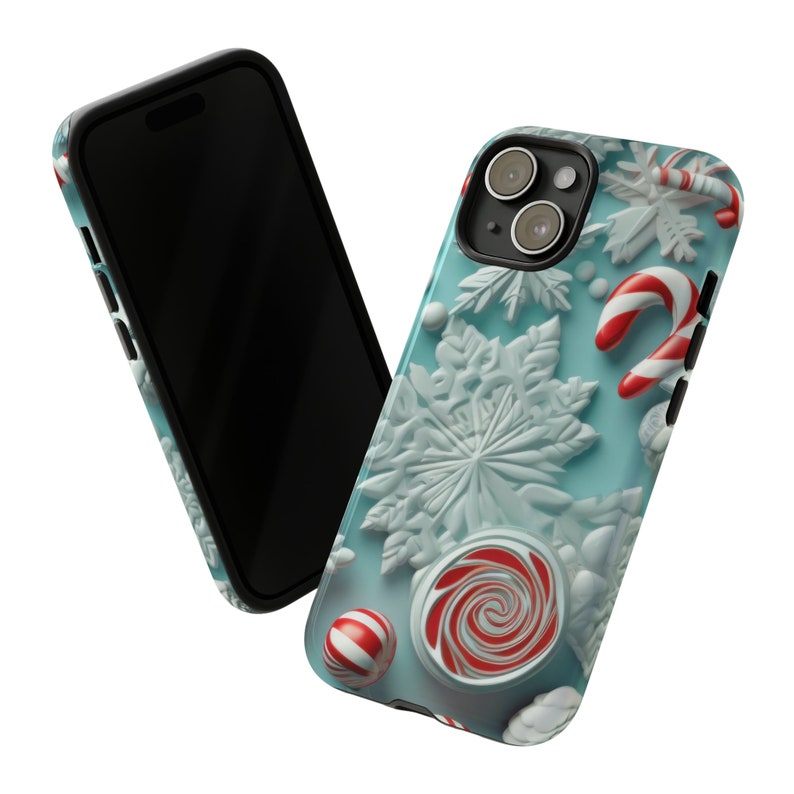 Puede incluir: Una funda de tel&eacute;fono azul con un tema navide&ntilde;o de invierno. La funda presenta copos de nieve blancos, bastones de caramelo y caramelos rojos y blancos.