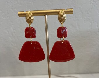 Red asymmetrical earrings