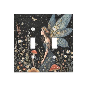 May include: A decorative light switch cover featuring a fairy with large blue wings, a floral crown, and a dark blue dress. The background is black with a starry night sky, mushrooms, and flowers.