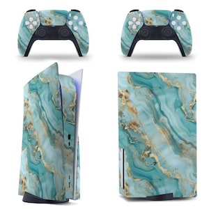 May include: A set of gaming accessories featuring a teal and gold marble design. The set includes two game controllers and a gaming console. The controllers and console have a matching pattern of swirling teal and gold, creating a cohesive aesthetic.
