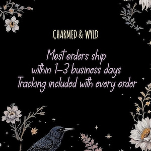 May include: Black background with floral and raven illustrations. Text in the center reads "CHARMED & WYLD" and "Most orders ship within 1-3 business days. Tracking included with every order."
