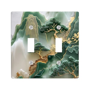 Puede incluir: Cubierta de interruptor de luz cuadrada con un diseño de paisaje sereno. La obra de arte muestra montañas verdes, árboles y detalles dorados. La cubierta tiene dos aberturas para interruptores y tornillos plateados.