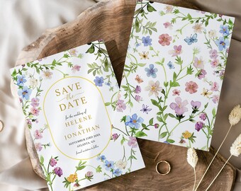 May include: Save the date card with a floral design. The card features a gold oval with the text "Save the Date" and the names Helene and Jonathan. The date is September 23rd, 20XX and the location is Atlanta, GA.