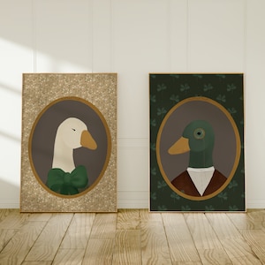 May include: Two framed illustrations of animals in a vintage style. The first illustration features a white goose wearing a green bow tie against a gold background with a white floral pattern. The second illustration features a green duck wearing a brown vest and a monocle against a green background with a shamrock pattern.