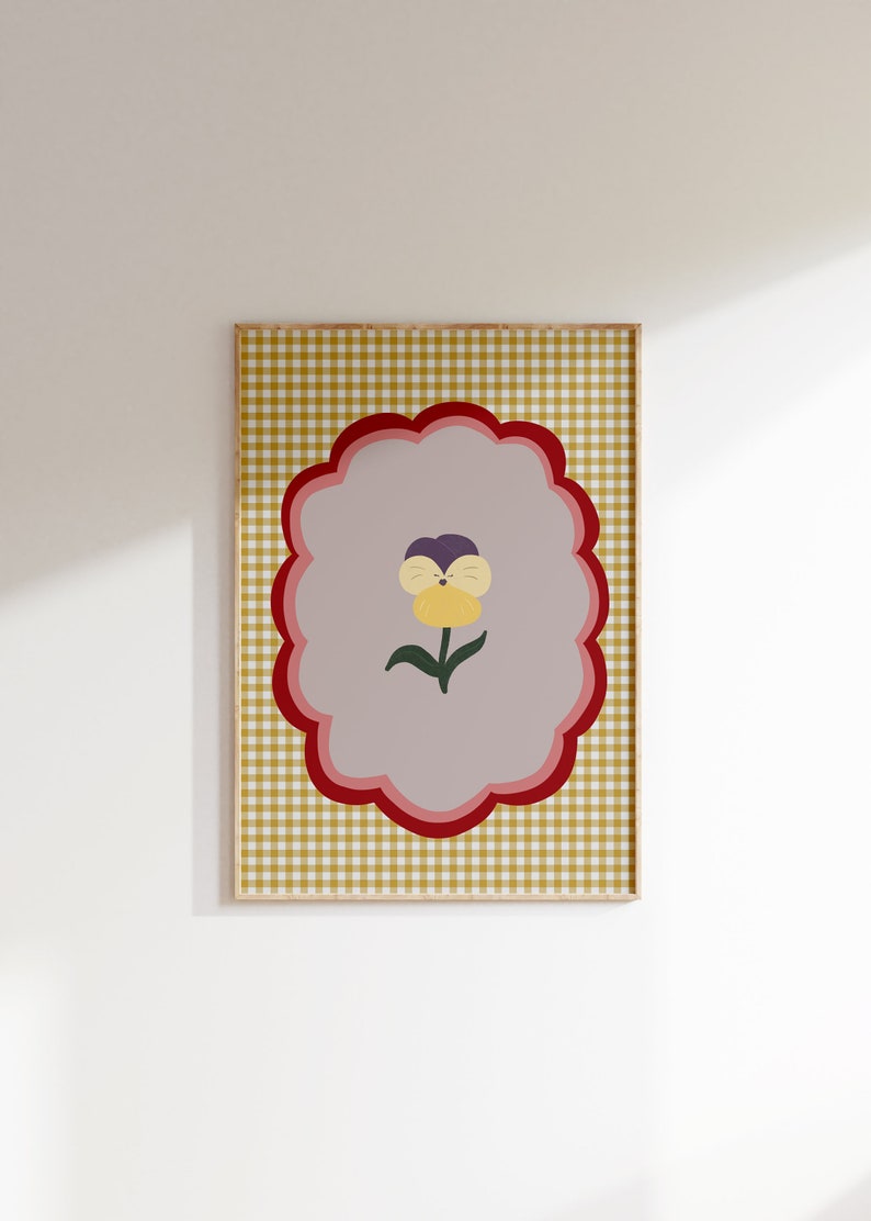May include: A yellow, purple, and green flower with a smiling face is centered on a light purple background. The background is surrounded by a red, pink, and white scalloped border. The border is on a yellow and white gingham background.