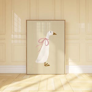 May include: A white goose with a pink bow on its neck is illustrated on a beige background with vertical stripes. The goose is facing right and has a long neck and beak.