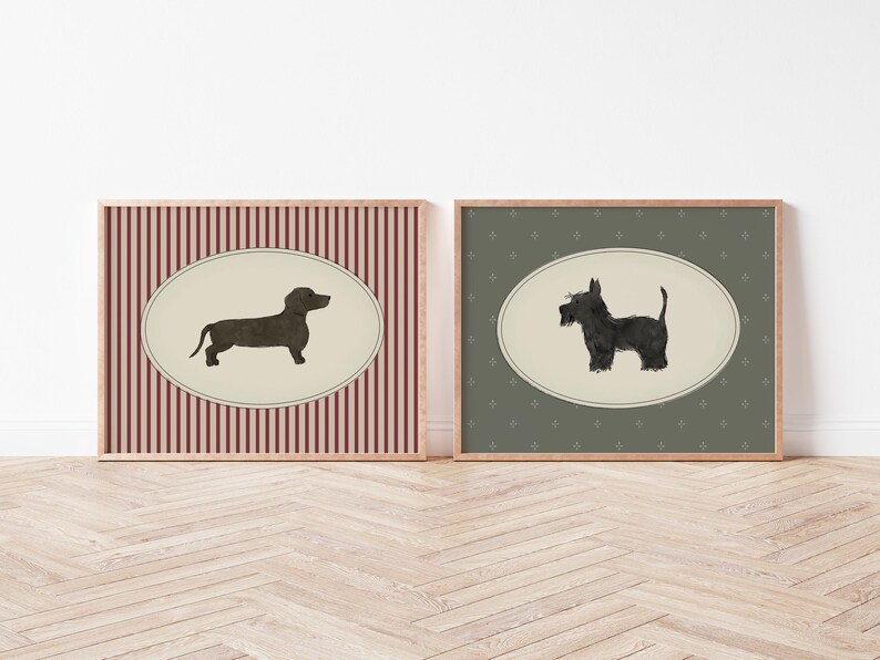 May include: Two framed dog art prints. One features a dachshund silhouette on a cream oval against a red and white striped background. The other shows a Scottish Terrier on a cream oval against a green patterned background.