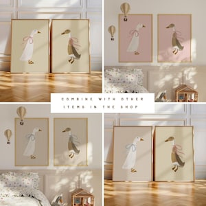 May include: Two sets of framed prints featuring illustrations of geese with blue ribbons. The prints have a cream background with vertical stripes. The text "COMBINE WITH OTHER ITEMS IN THE SHOP" is displayed below the prints.