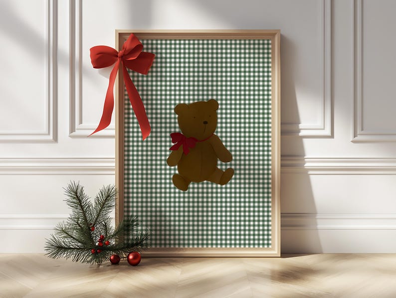 May include: A framed print with a green and white gingham pattern featuring a brown teddy bear with a red bow.