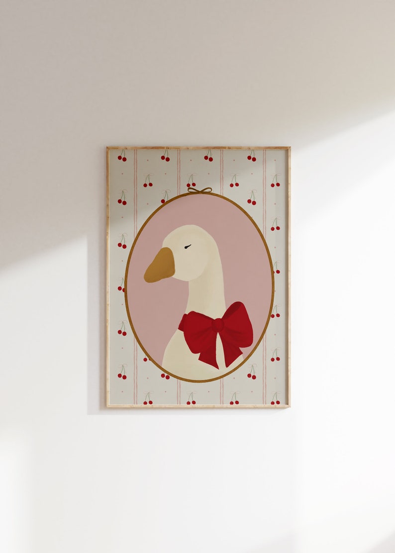 May include: A framed illustration of a white goose with a red bow, set against a background of pink and white stripes with red cherries.