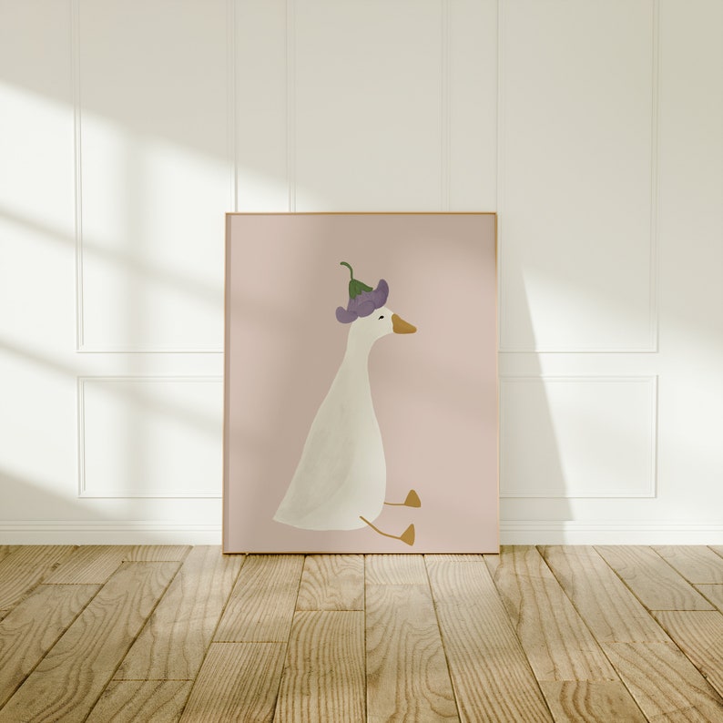 May include: A white goose with a purple flower on its head sits on a pink background. The goose is looking to the right.