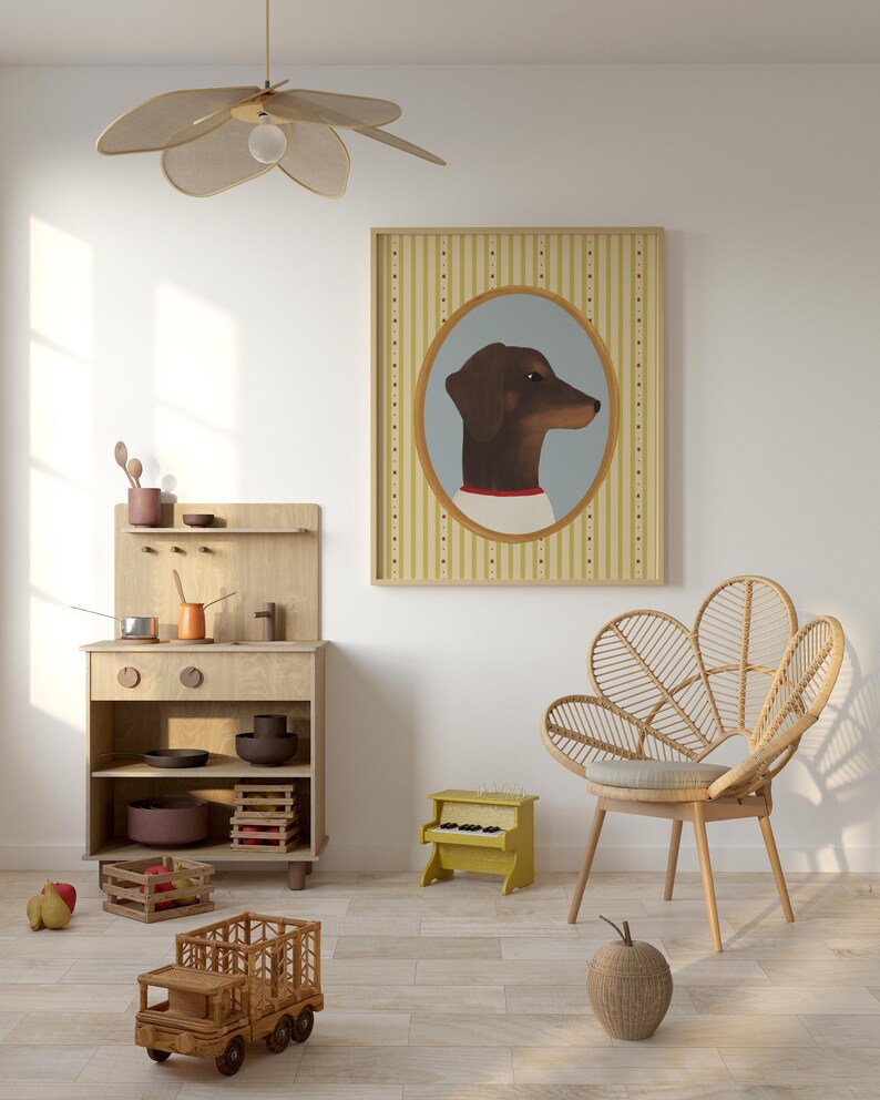 May include: A framed portrait of a dachshund dog in an oval frame hangs above a wooden toy kitchen set, a yellow toy piano, and a wooden truck. A woven chair and a decorative apple are also in the room. A flower-shaped ceiling fan hangs from the ceiling.