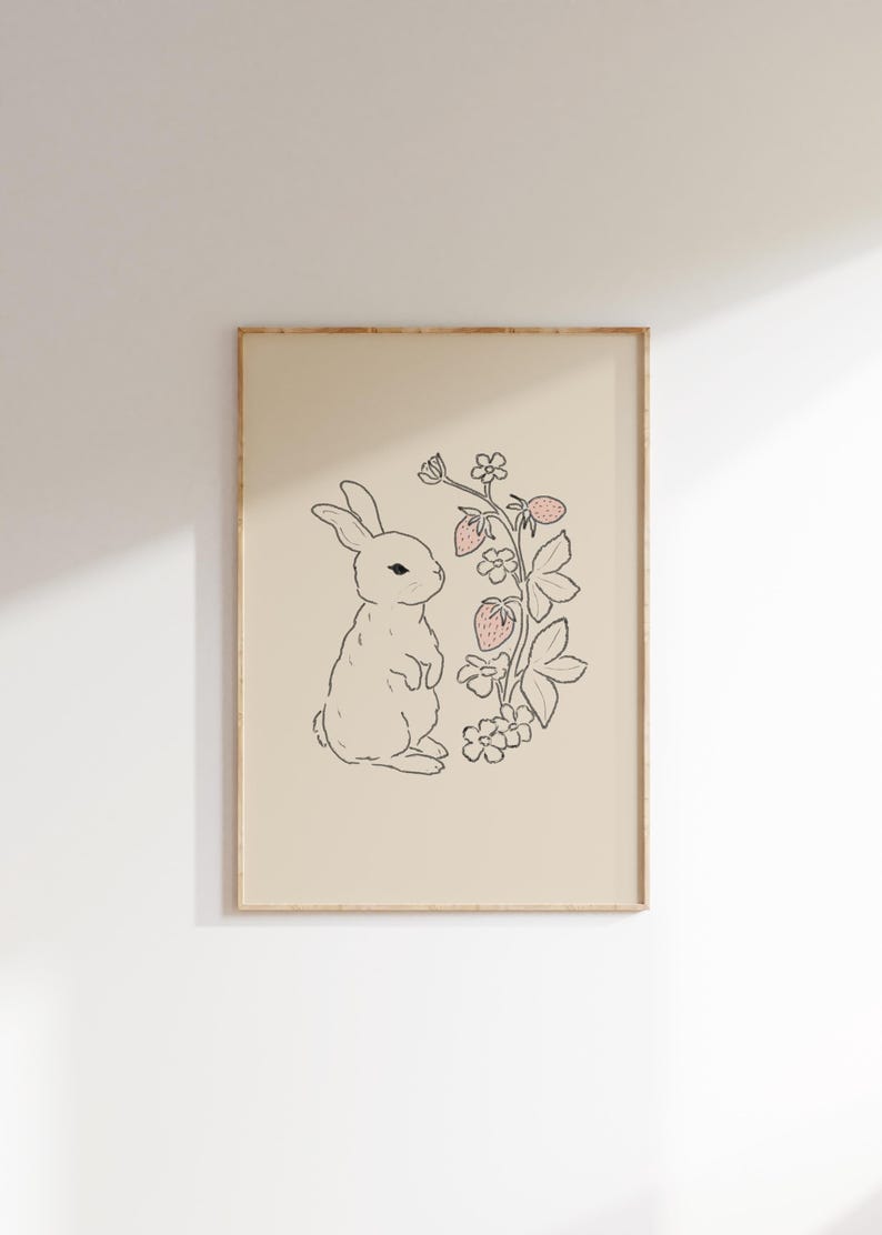 May include: A black and white line drawing of a rabbit standing next to a plant with pink strawberries. The background is a light beige color.