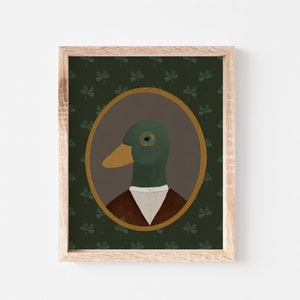 May include: A framed illustration of a duck wearing a monocle and a brown jacket, set against a green background with a clover pattern.